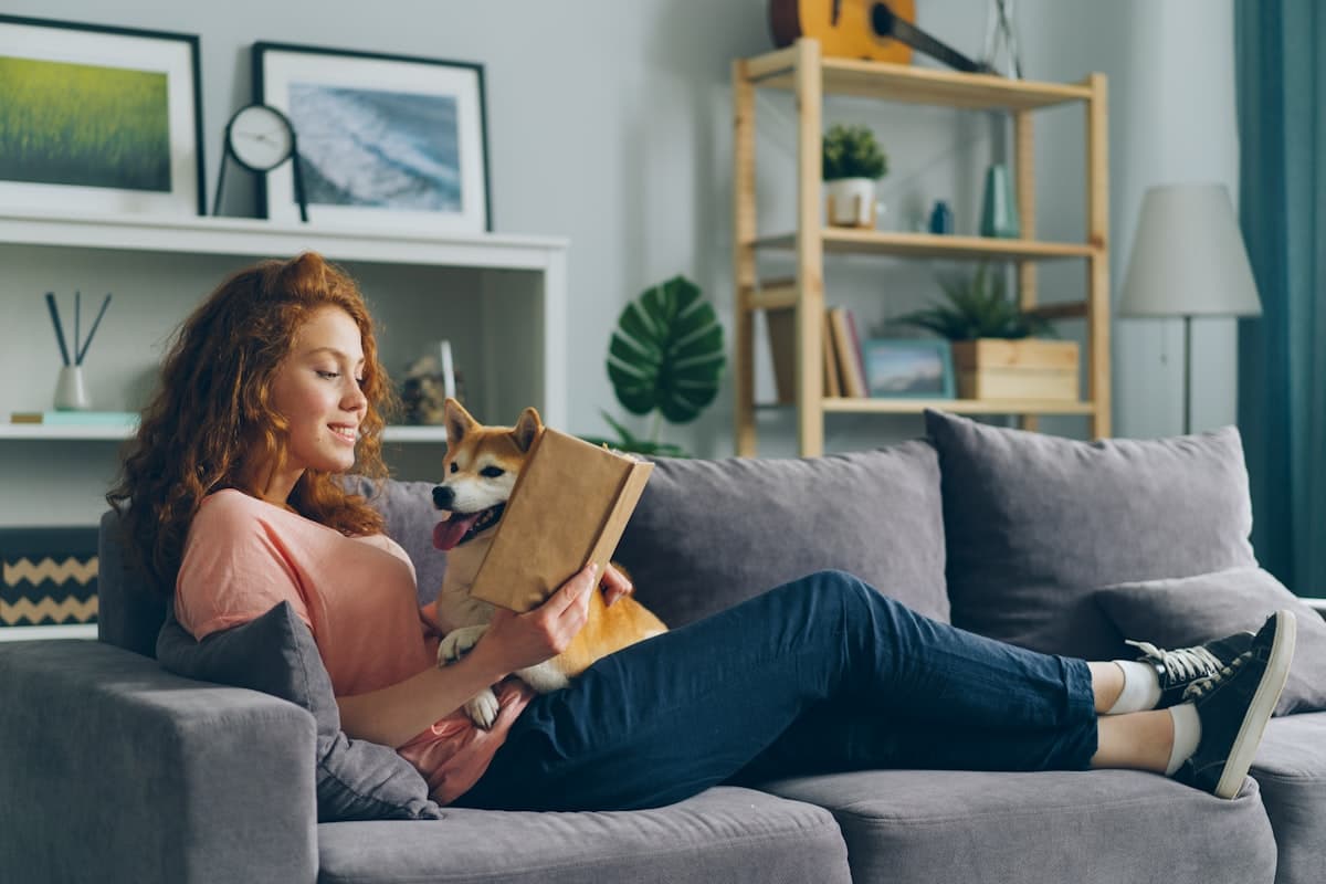 Person relaxing at home with their dog